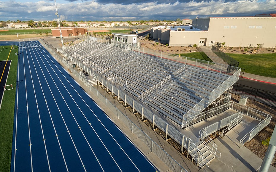 large high capacity bleachers on a track and field